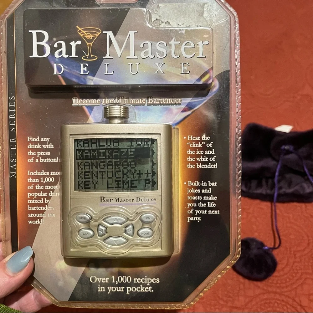 Bar Master recipes, cocktail strainer, and bottle cover